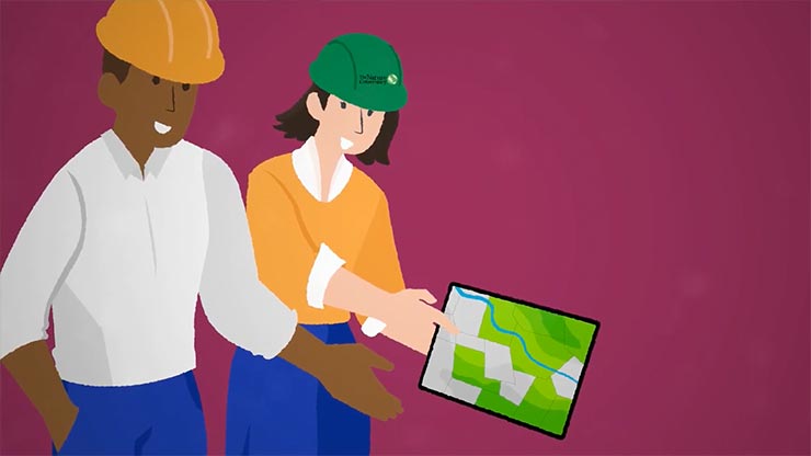 An illustration of two people in hard hats looking at a tablet with a map of greenery and a river.