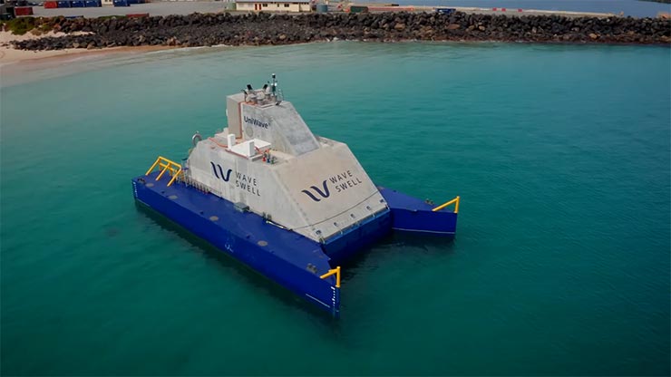 A large, white-and-blue marine energy device floating in water, with branding that reads Wave Swell.