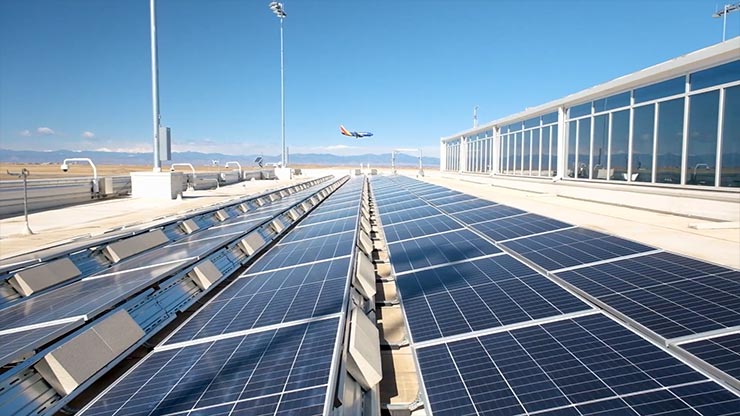 A person peeking into the window of a futuristic-looking airplane cockpit.