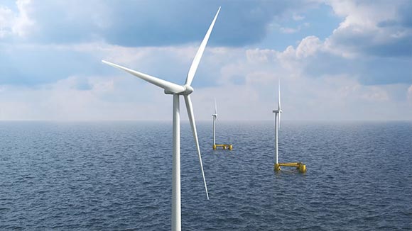 Three offshore wind turbines floating on a calm ocean under a partly cloudy sky, with one turbine prominently shown in the foreground and two in the background mounted on yellow floating platforms.